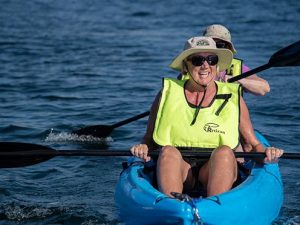 Alya passengers having fun on kayaks.